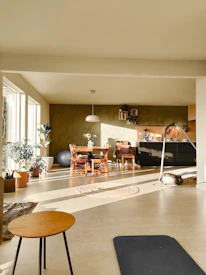 A warm, welcoming living space with natural light and comfortable seating.