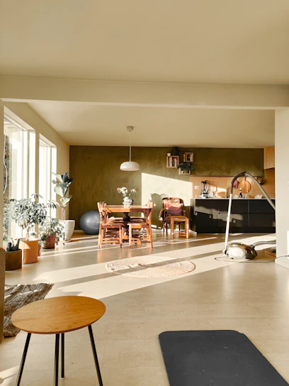 A vibrant hopping mat laid out in a cozy living room with natural light streaming in.