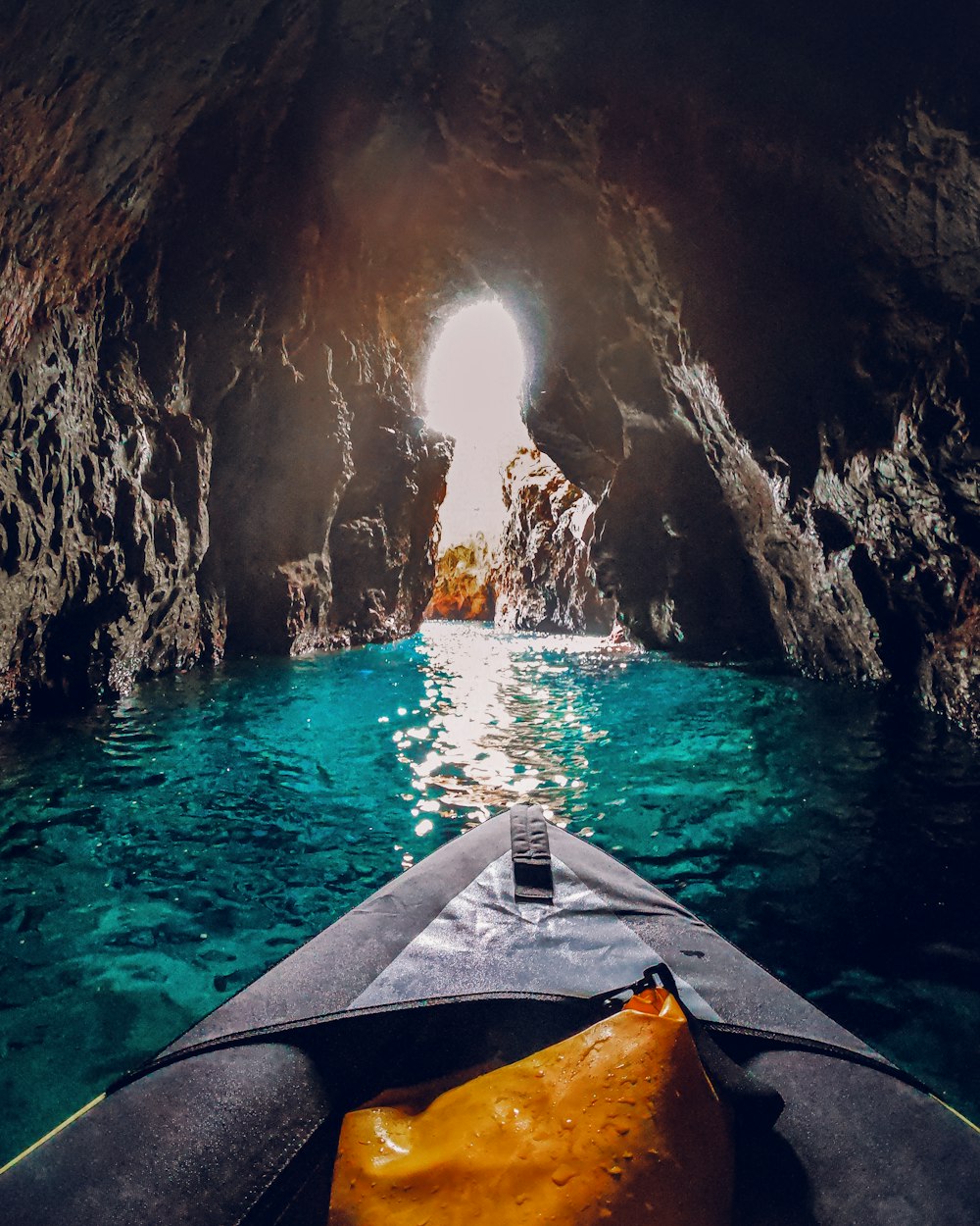 a view of the inside of a cave from a kayak