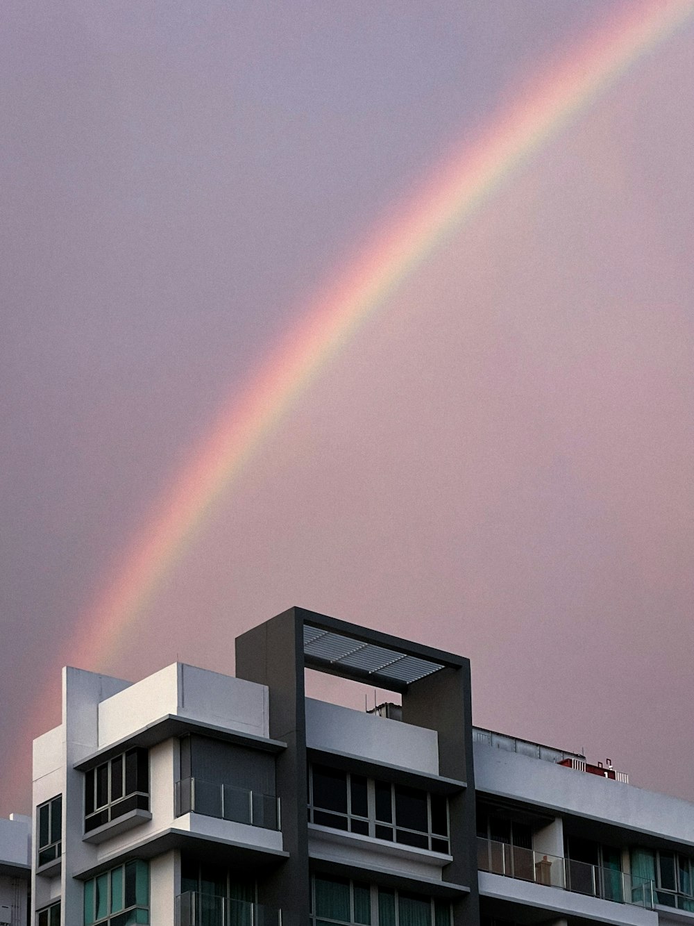 a double rainbow is seen over a building