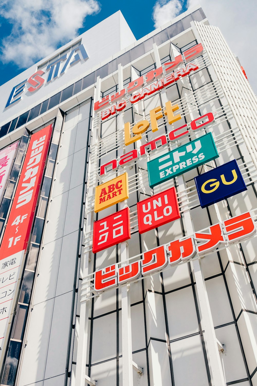 a tall building with a bunch of signs on it