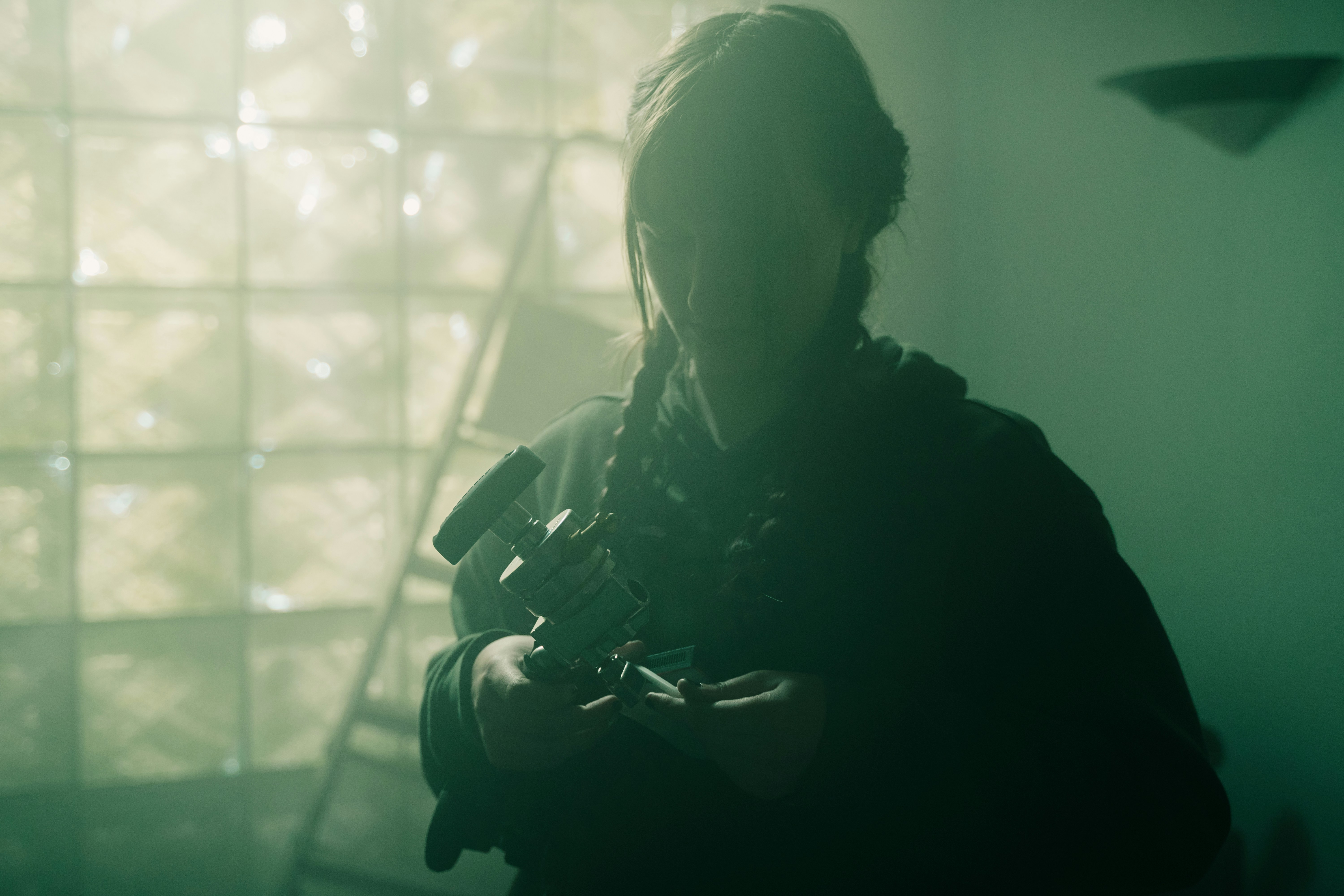 a person standing in a room with a camera