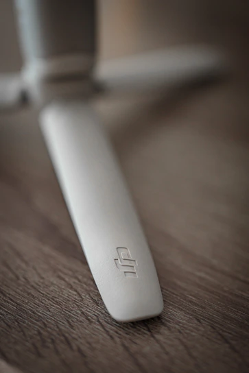 A close-up of a custom marine propeller with detailed craftsmanship under sunlight.
