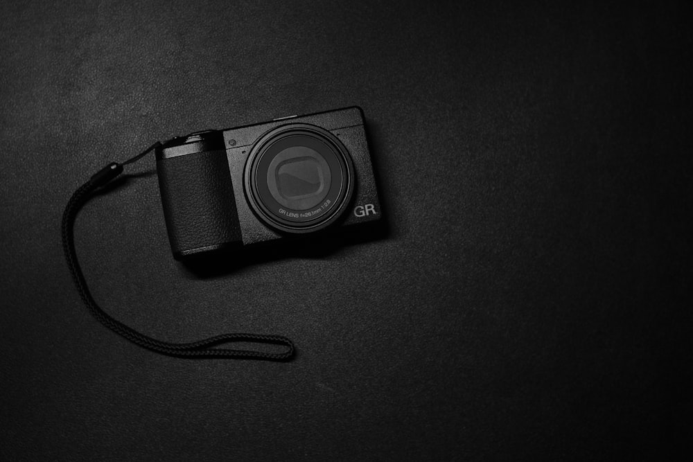 a camera sitting on top of a black table
