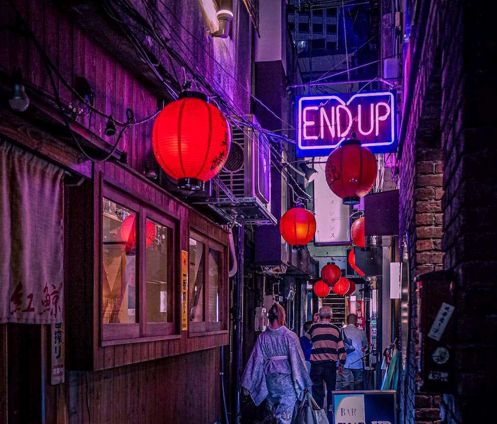 a person walking down a narrow alley way