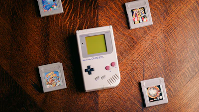 A nostalgic setup featuring the Game Boy Advance SP alongside other classic handheld consoles.