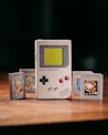 a nintendo game boy sitting on top of a wooden table