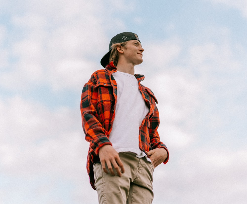 a man standing on top of a skateboard