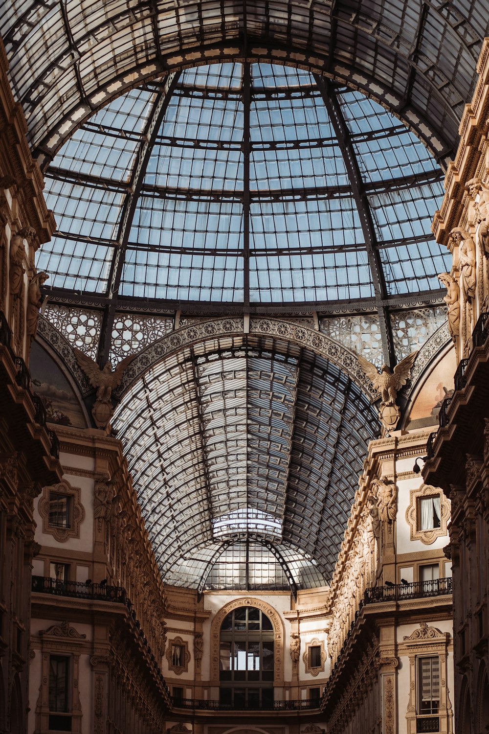 a large building with a glass ceiling and a clock