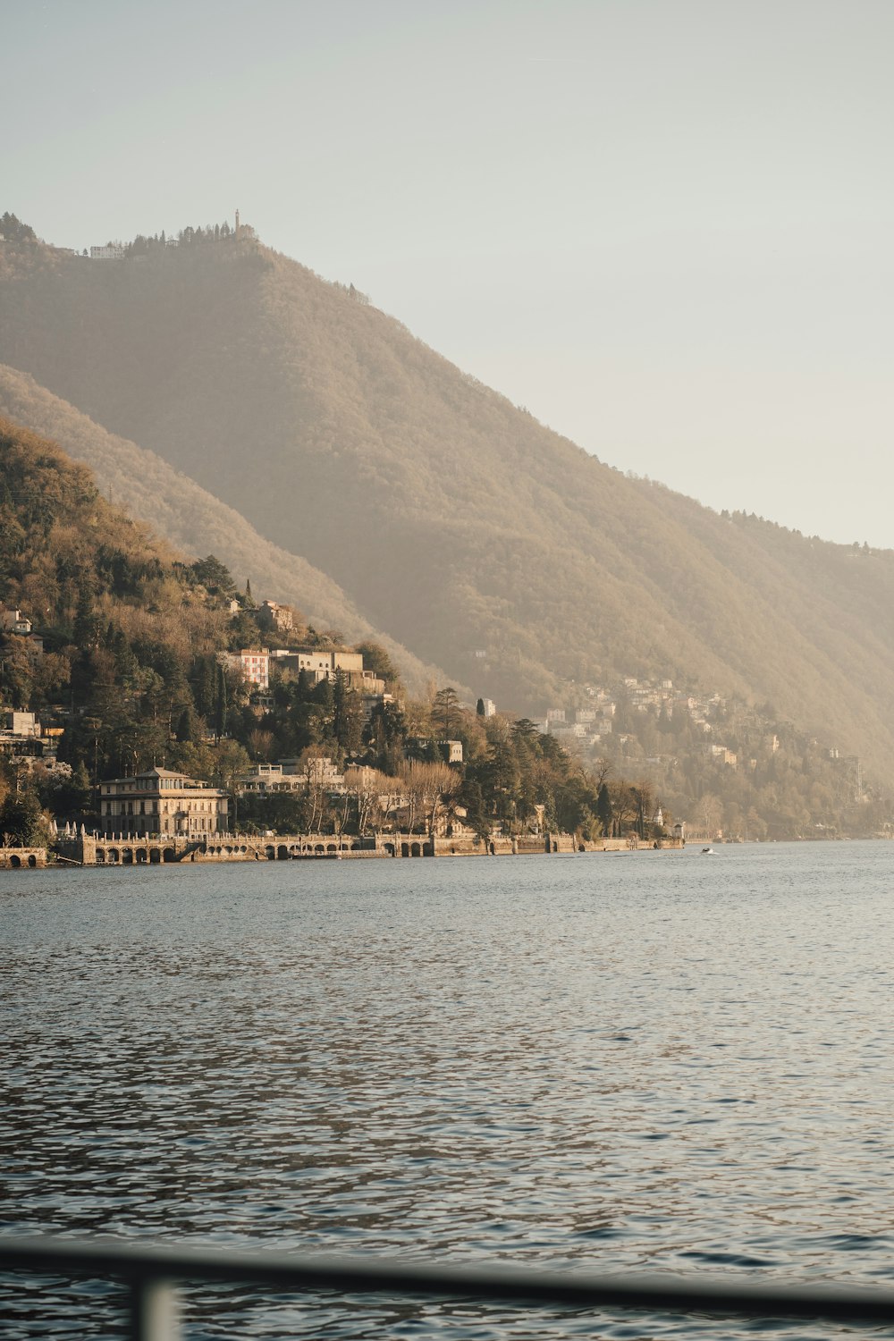 a body of water with a mountain in the background