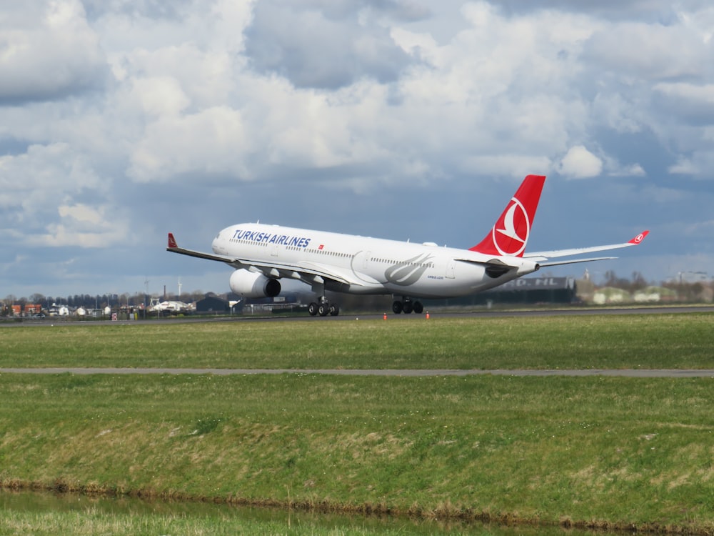 a large jetliner sitting on top of an airport runway