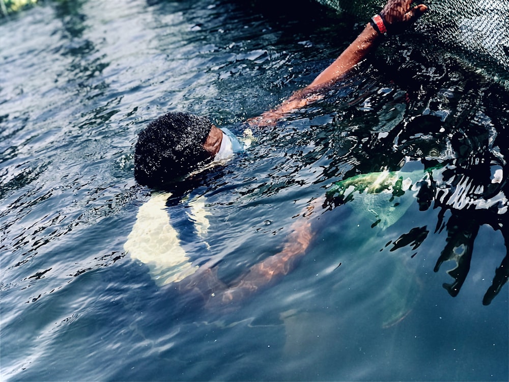 a person swimming in a body of water