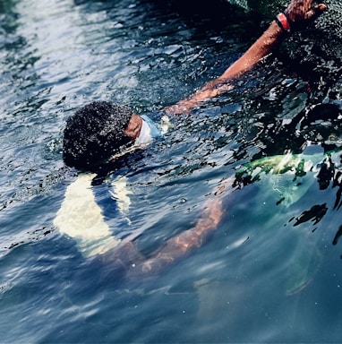 a person swimming in a body of water