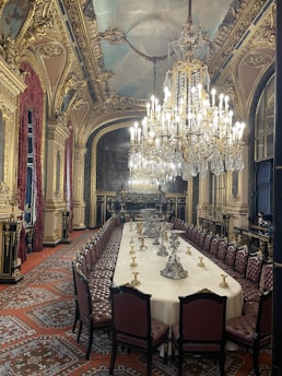 An opulent dining hall set for a grand event.