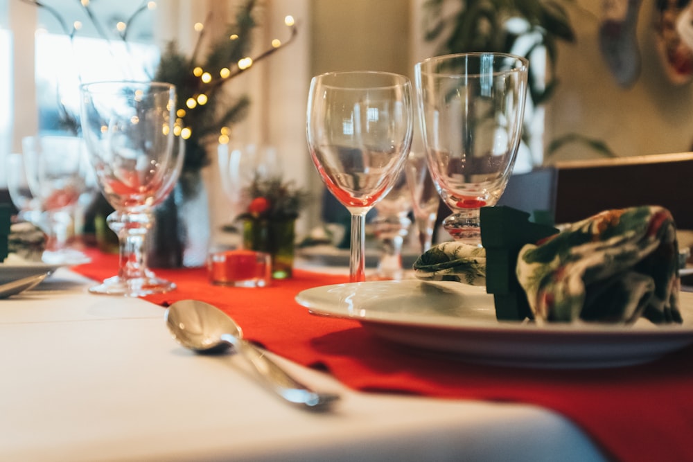 a close up of a table with wine glasses