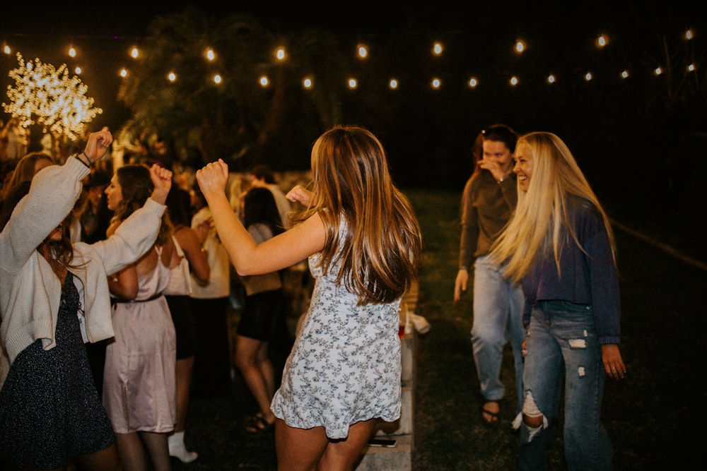 a group of people standing in front of a crowd