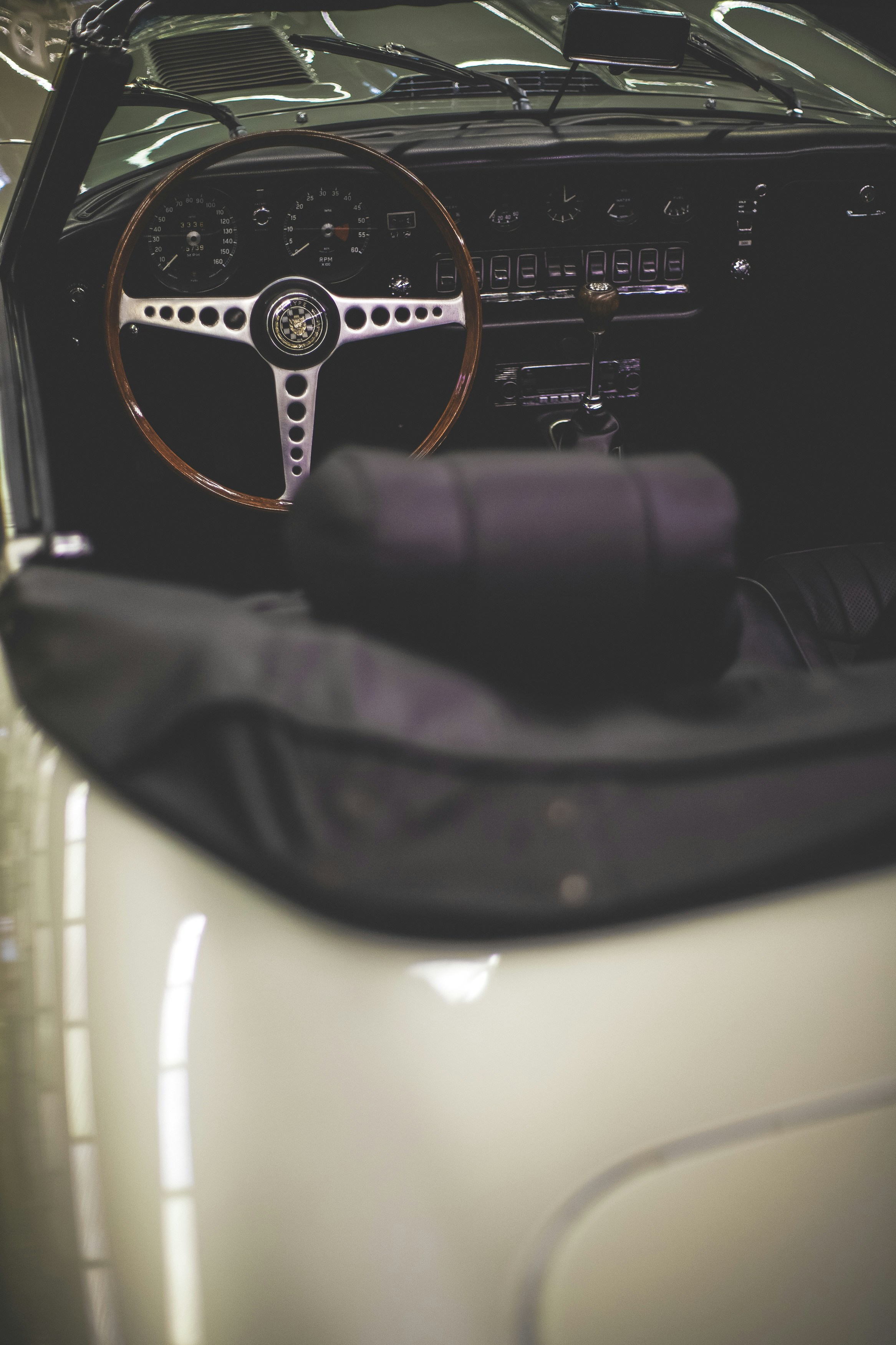 Classic Volkswagen Beetle dashboard with vintage transmission gear shift in focus.