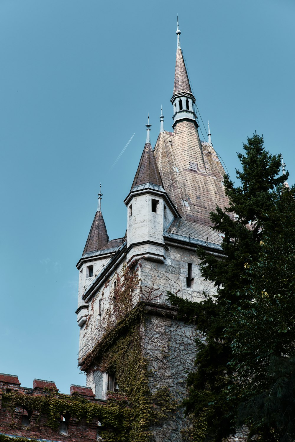 a very tall tower with a clock on it's side