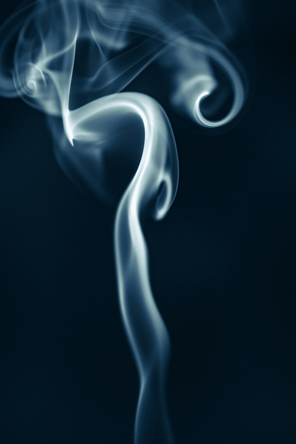 a blue background with smoke coming out of it