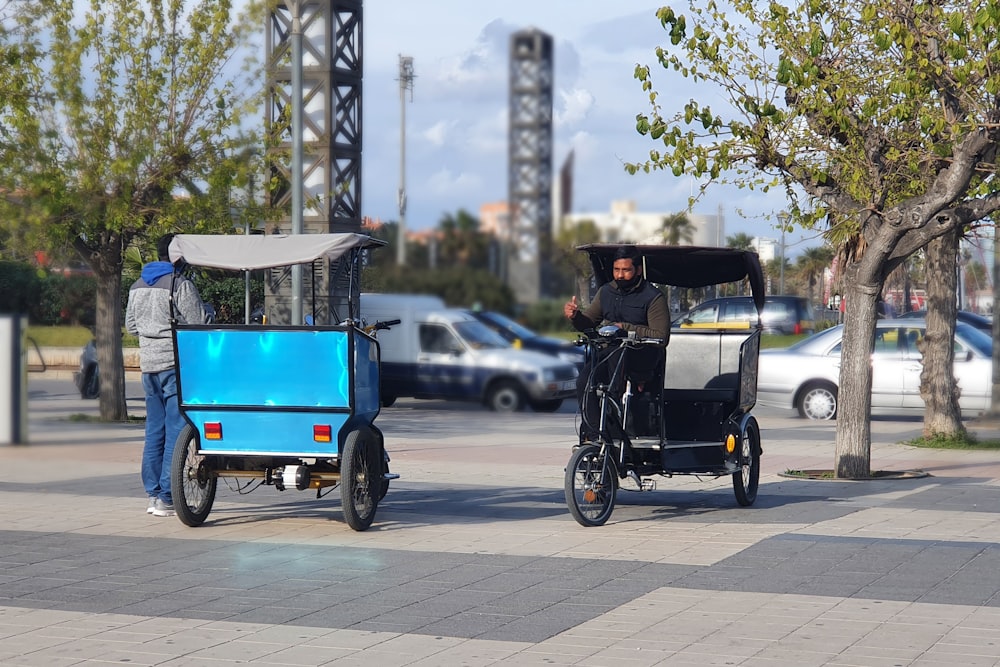 a man riding a rickshaw pulled by a horse