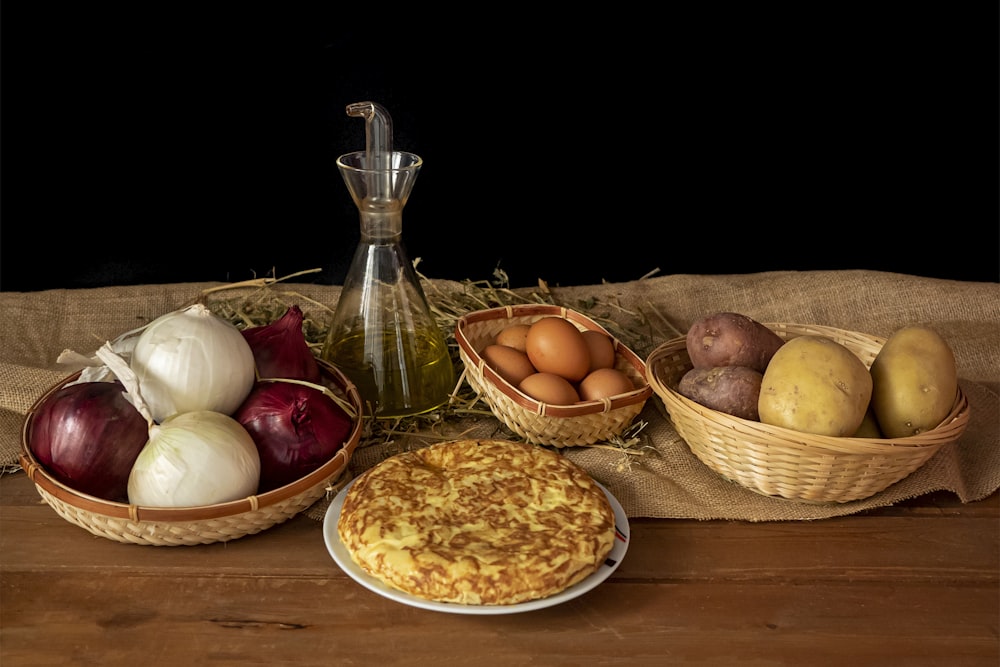 a table topped with bowls of food and a pie