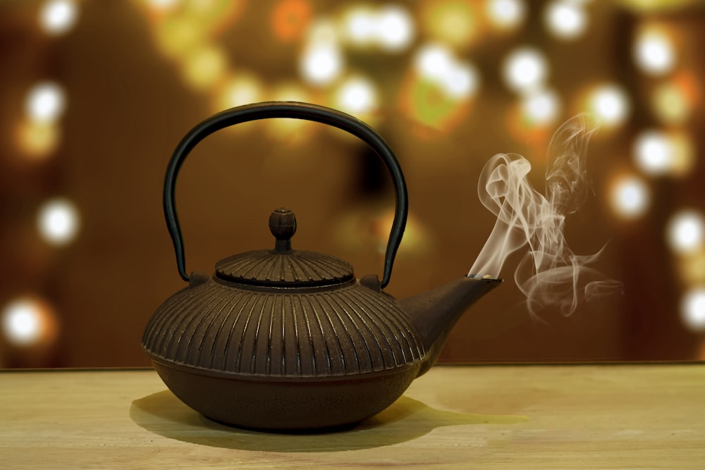 a teapot with smoke coming out of it