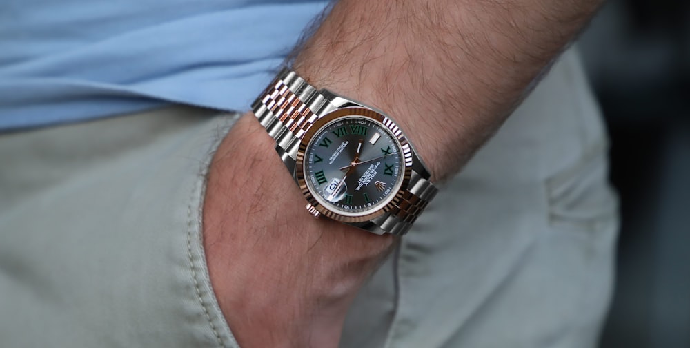 a close up of a person wearing a watch