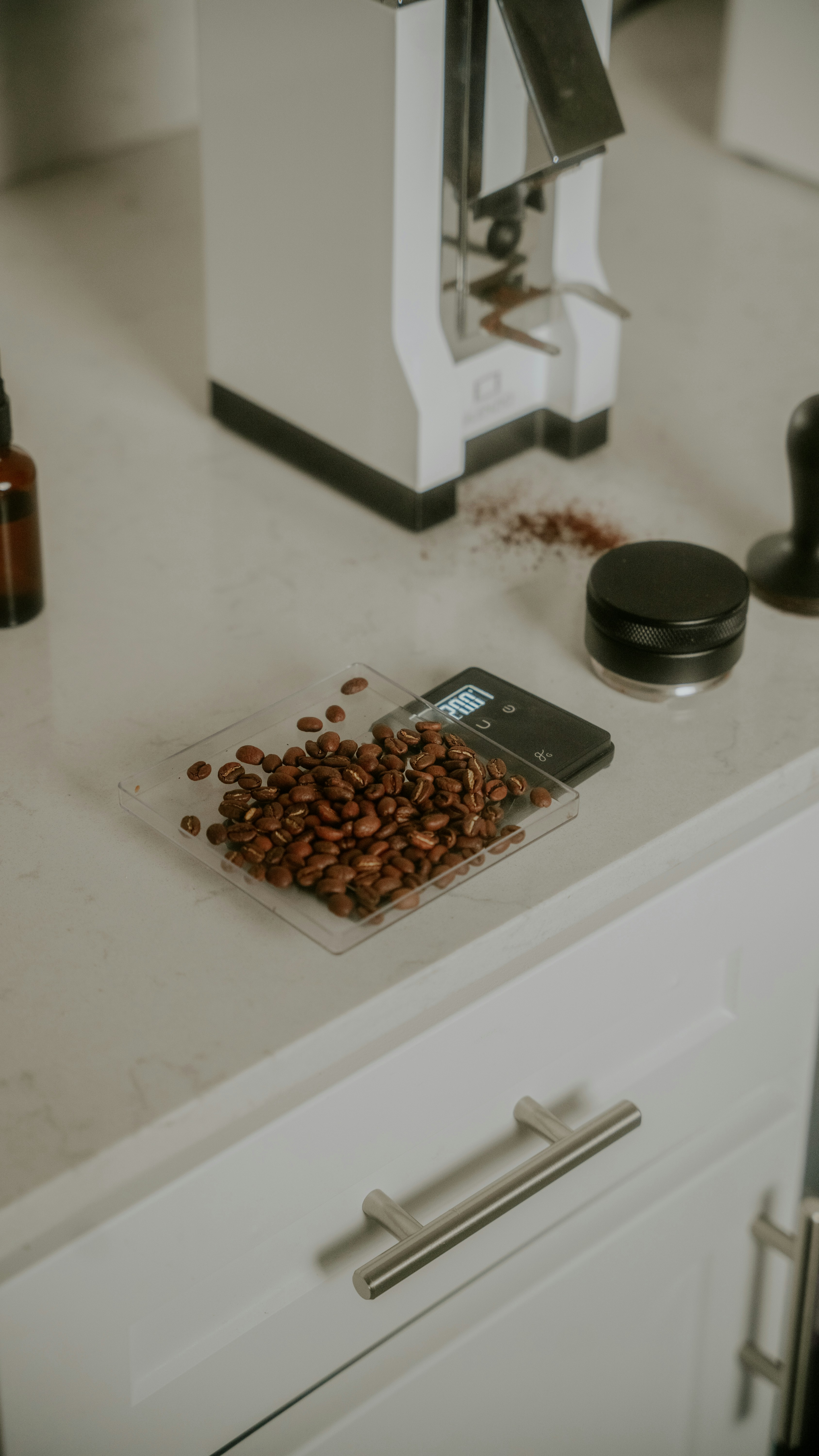 a coffee grinder sitting on top of a counter