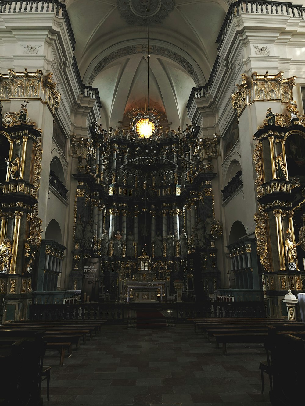 a church with gold decorations and a chandelier