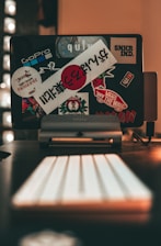 A friendly technician setting up a kid-friendly computer with fun stickers.