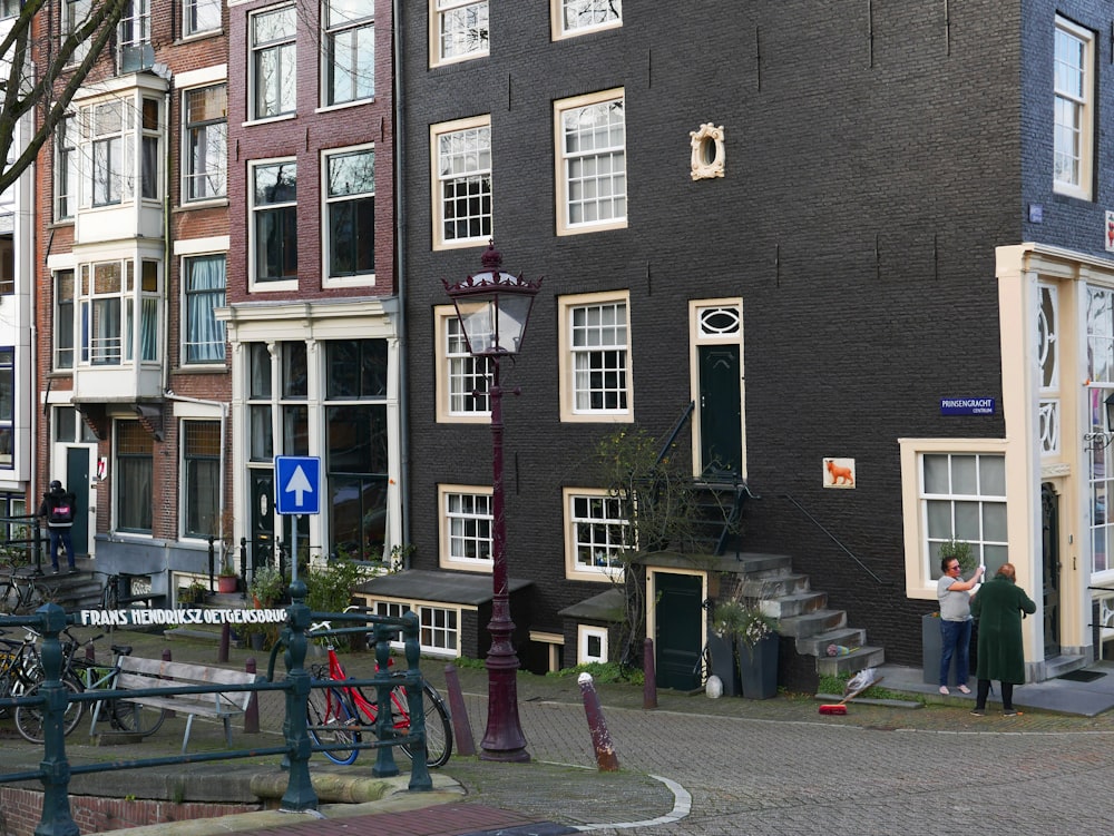 a group of people standing in front of a building