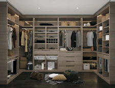 a walk in closet filled with lots of clothes
