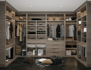 a walk in closet filled with lots of clothes