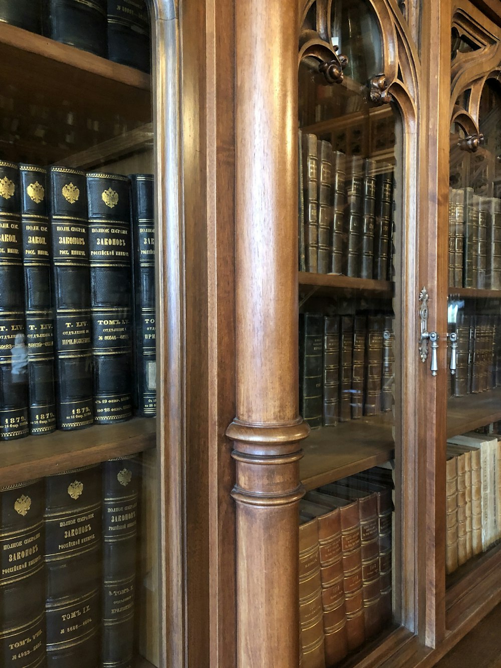 a wooden bookcase filled with lots of books