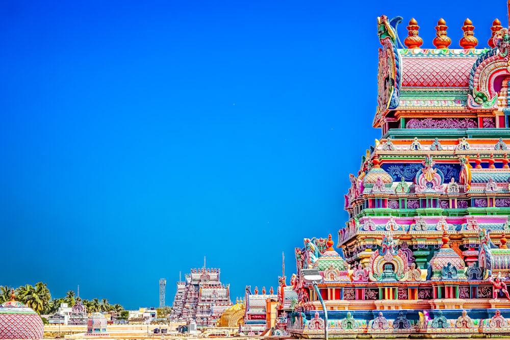 a very colorful building with a blue sky in the background