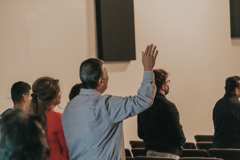 a man standing in front of a crowd of people