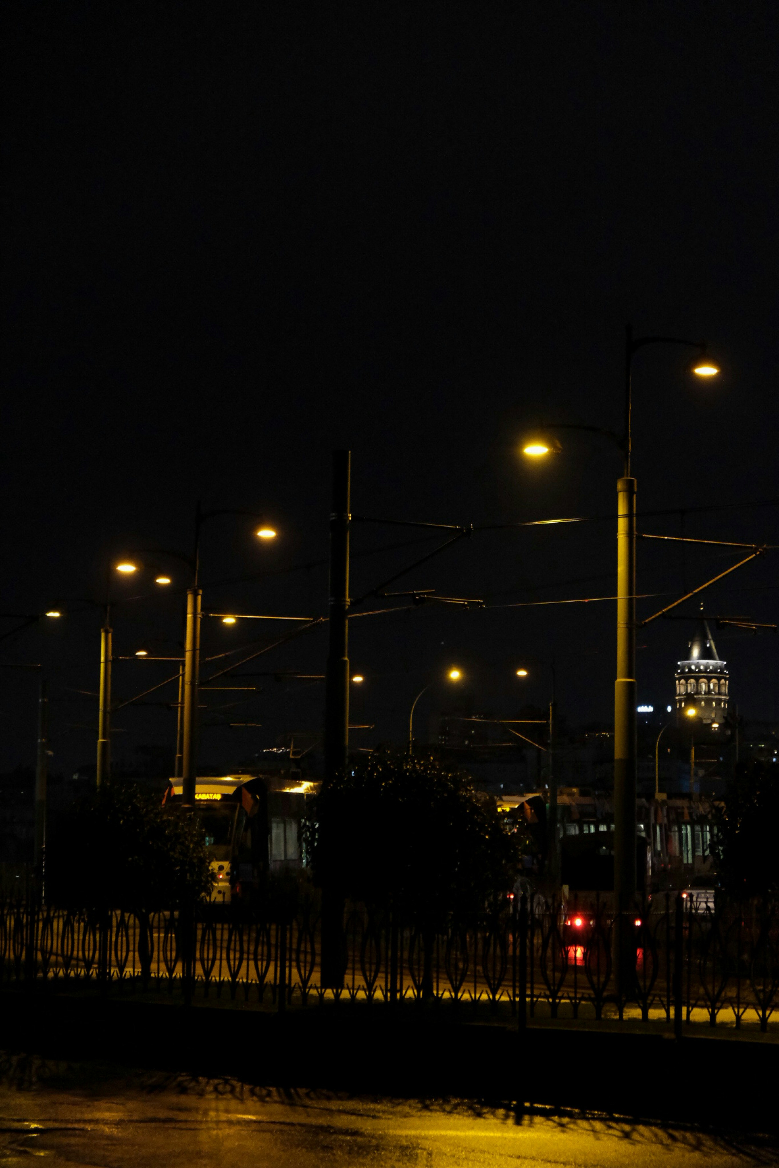 a city street at night with street lights