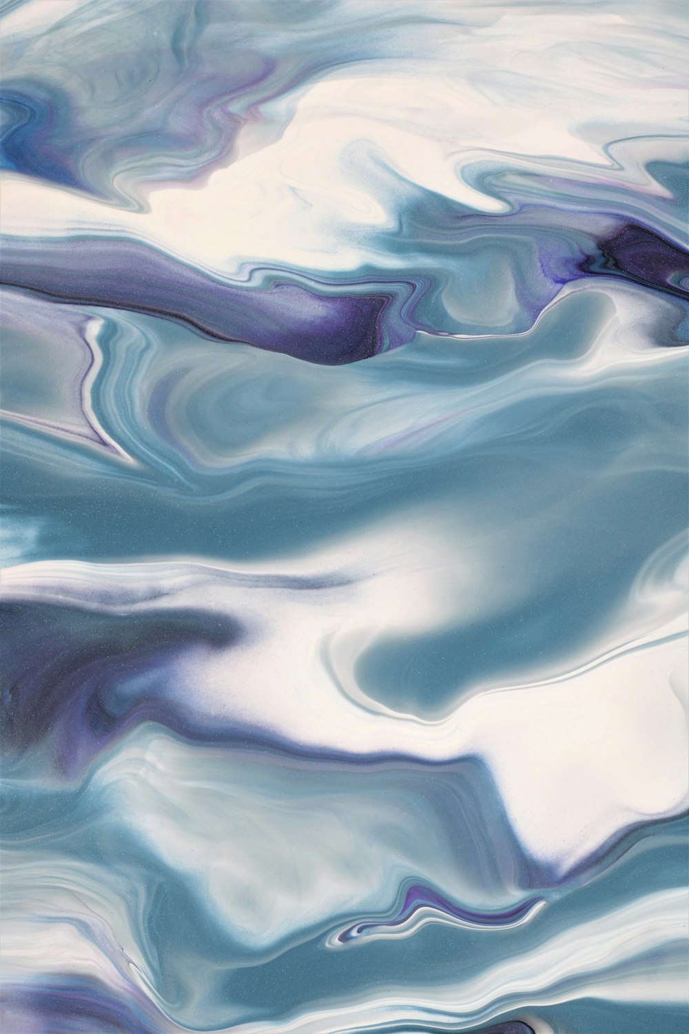 an abstract painting of blue and white water