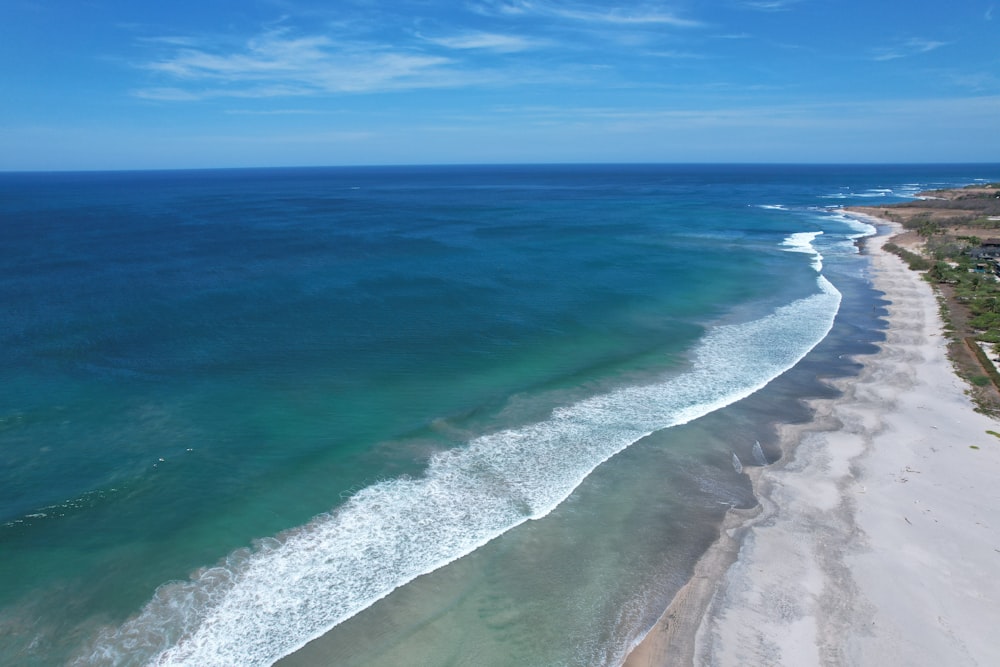 an aerial view of a beach and ocean