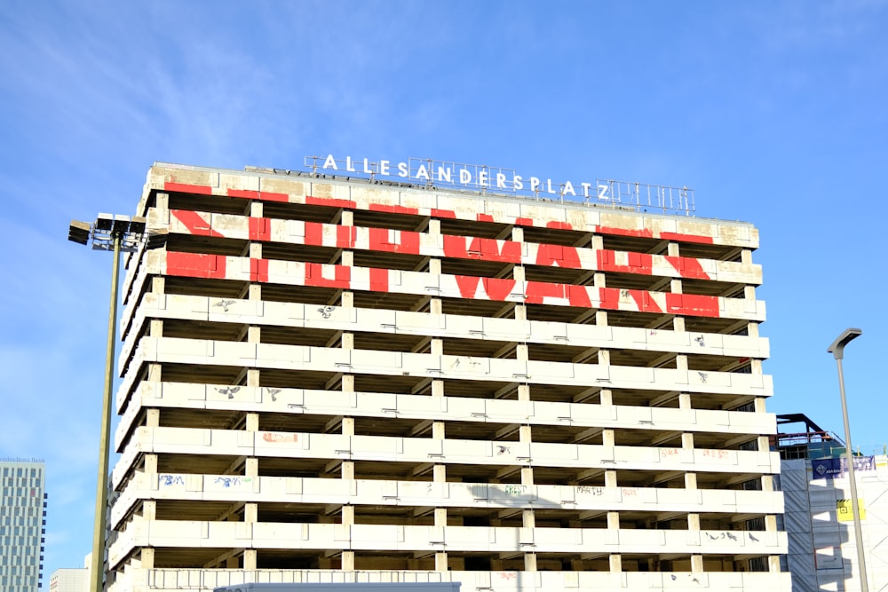 a tall building with a sign on top of it