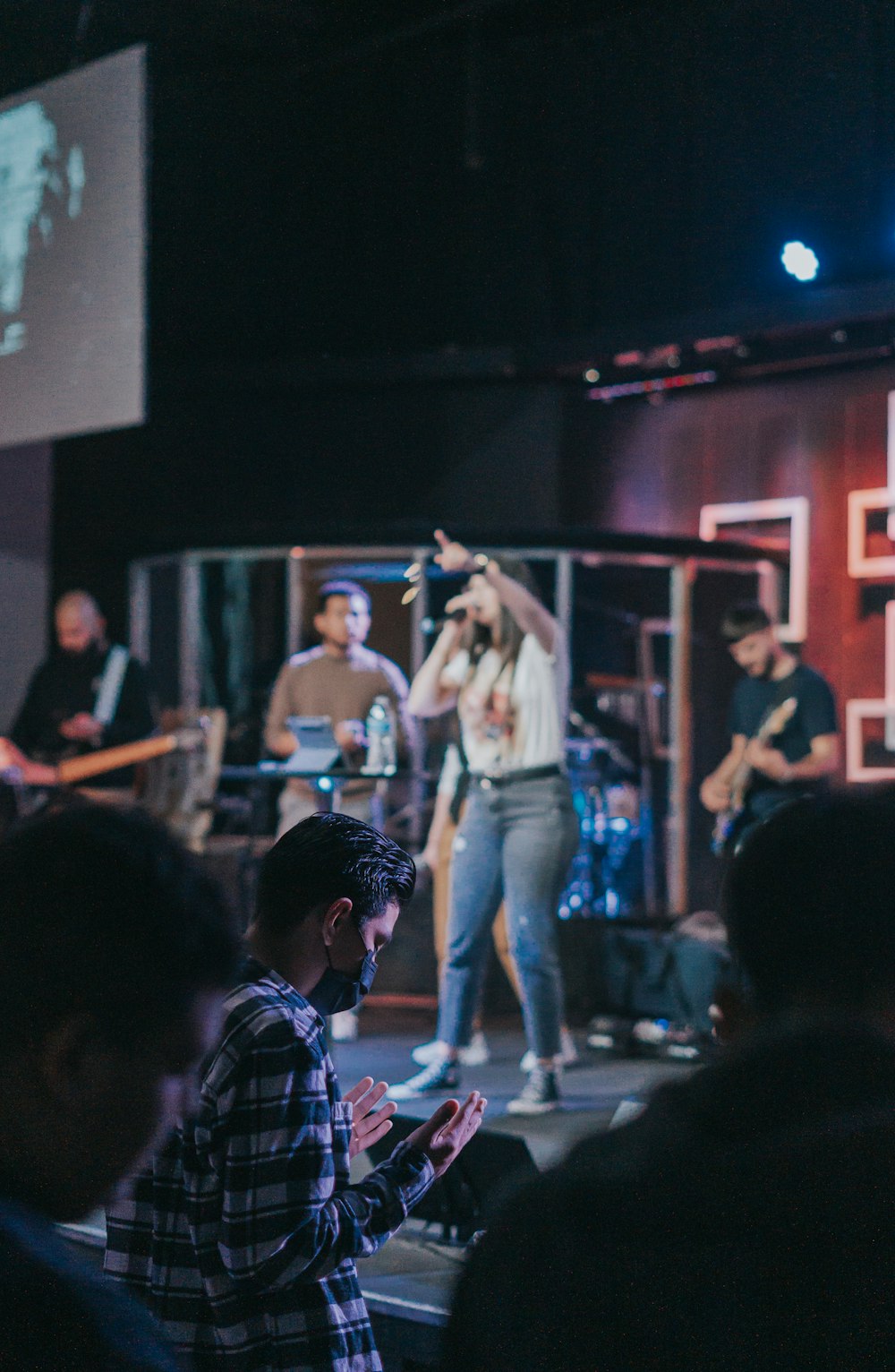 a group of people standing on top of a stage