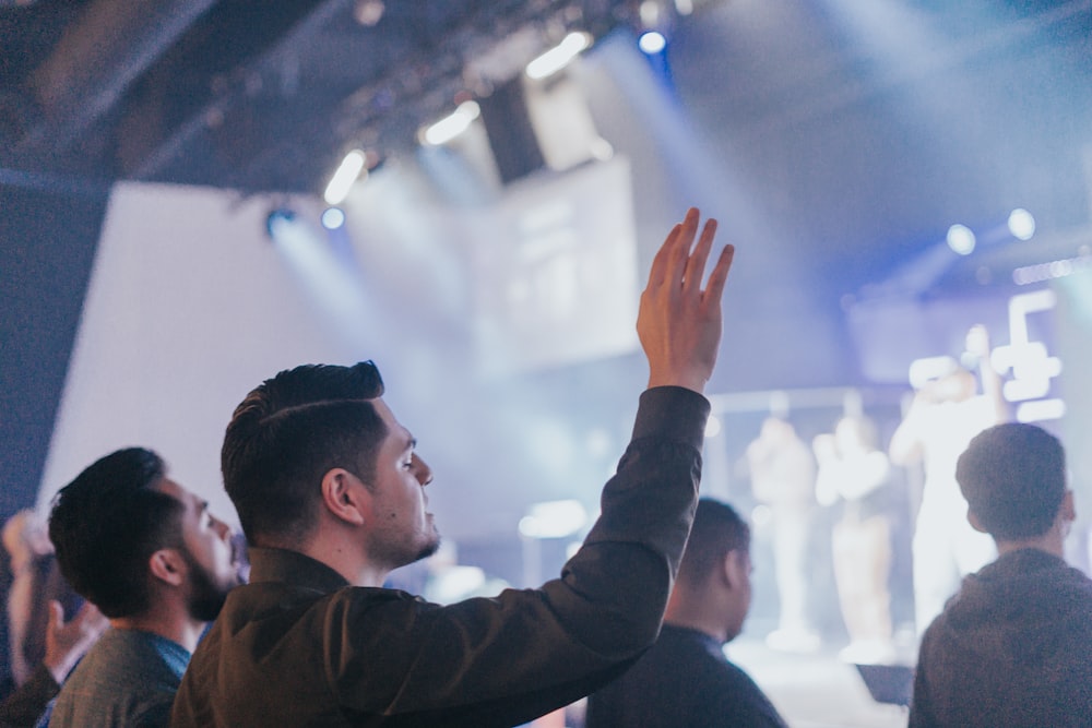 a man standing in front of a crowd of people