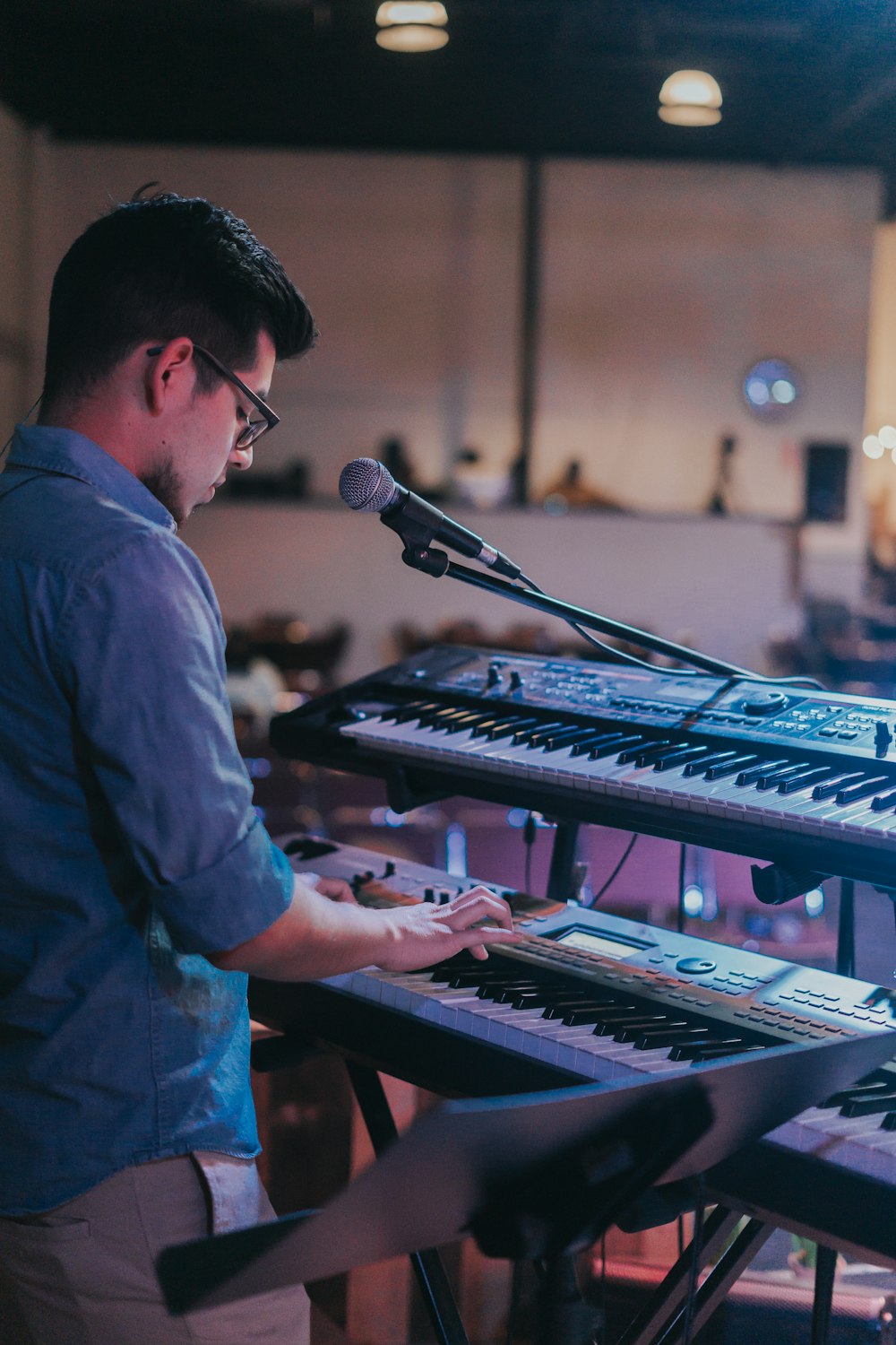 a man standing in front of a keyboard