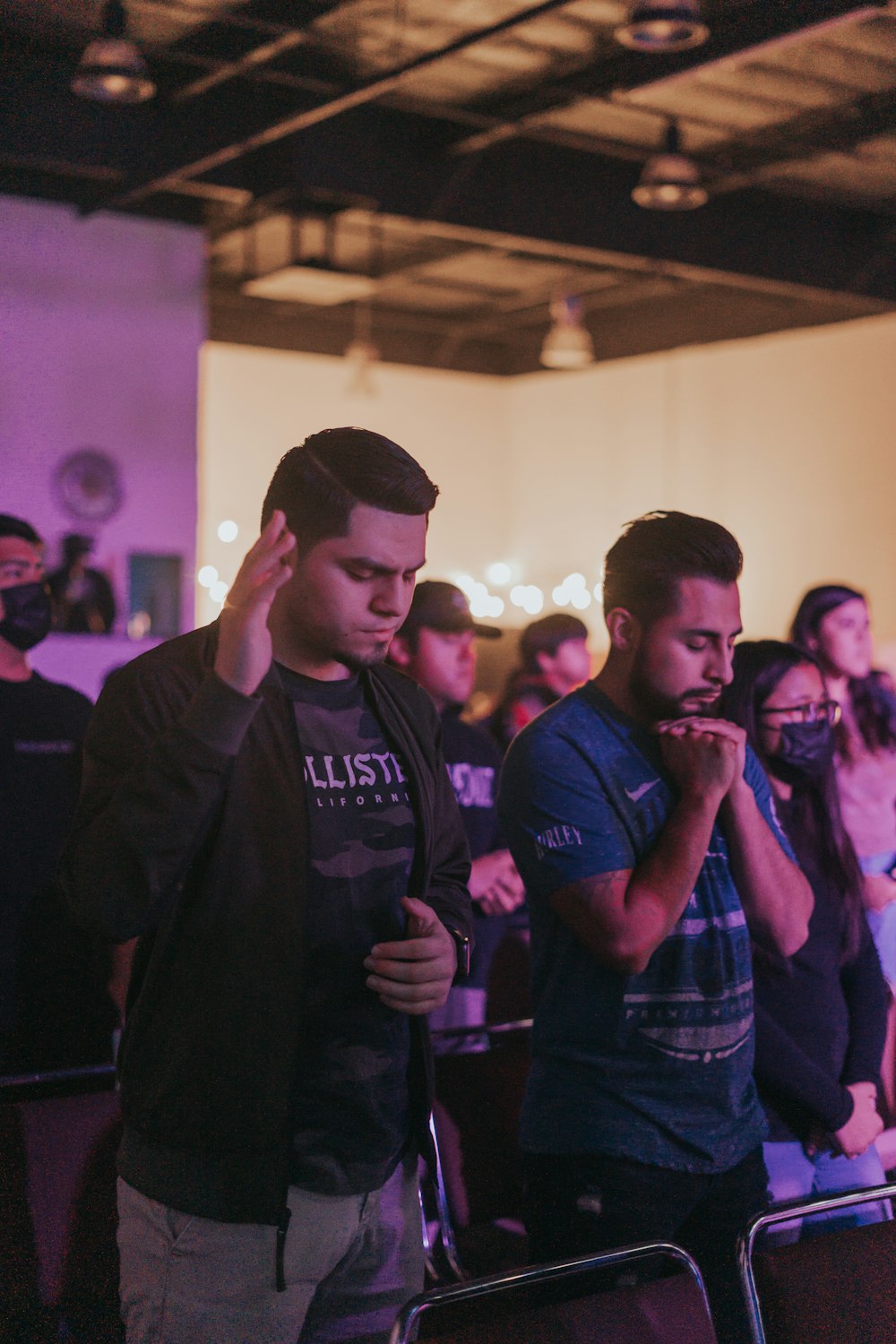 a group of people standing in a room