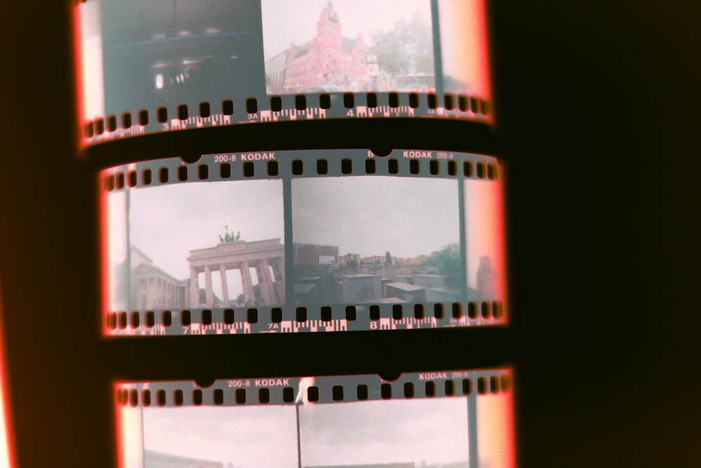 a close up of a film strip with a building in the background