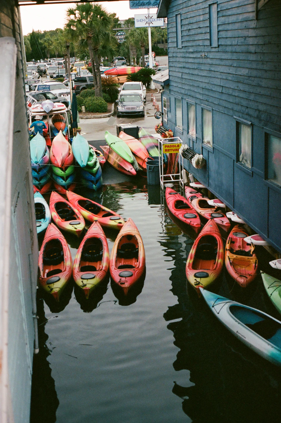 Colorful kayaks gathered at the waterfront