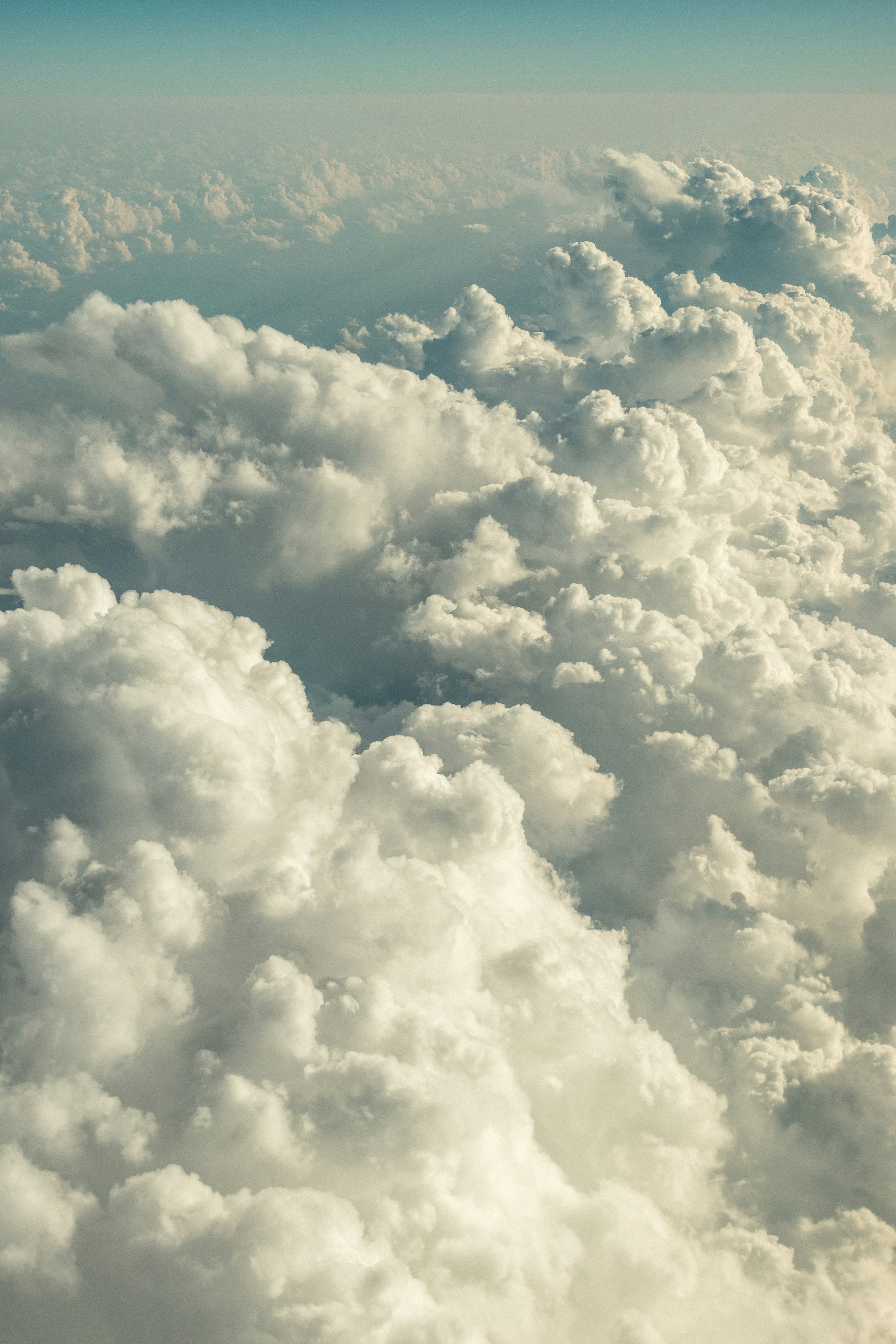 a view of the clouds from an airplane window