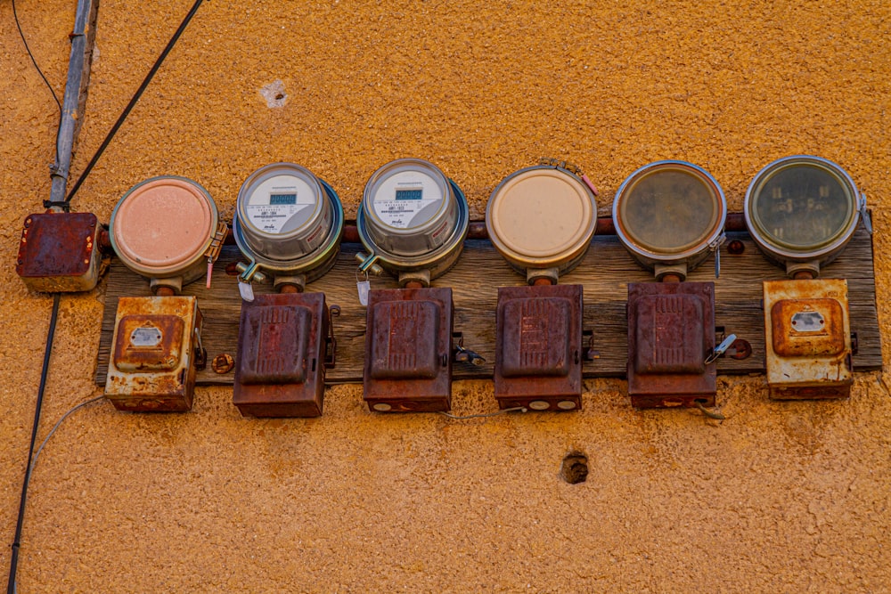 a bunch of different types of drums sitting on a wall