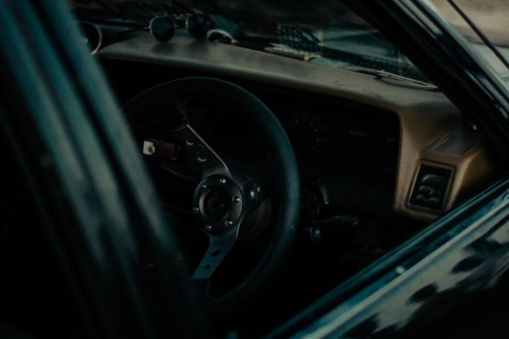 the interior of a car with a steering wheel