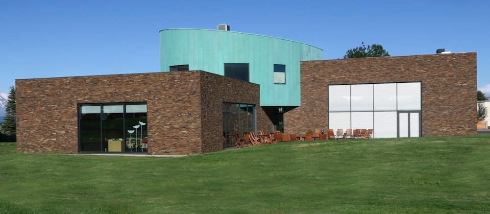 a large brick building with a green roof